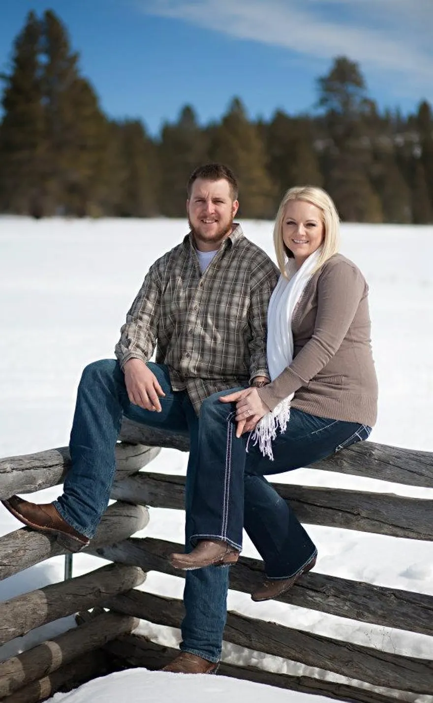 Zach and Jayne Hascall standing in the snow in Duck Creek Village
